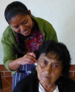 Mayan Health Promoter applies NADA protocol at Mediacal Workshop in Guatemalan Highlands